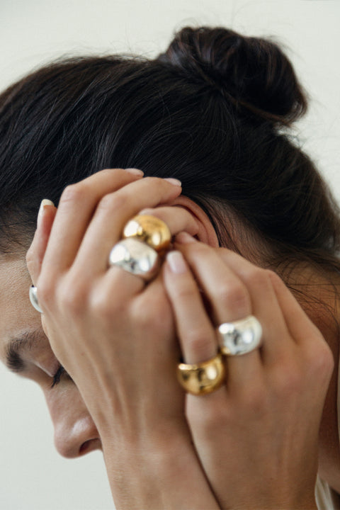 Discover the large, bold ring with a rounded, cylindrical shape from the RONDA collection by UMIAR jewelry. Handcrafted from 925 sterling silver or 24k gold, this spectacular ring is smoothly polished to beautifully reflect light, adding elegance to any minimalist outfit. A perfect accessory for any occasion. Buy now and add a touch of brilliance to your looks!
