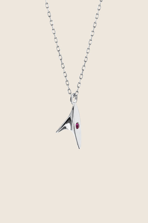 Discover our minimalist necklace featuring a pendant inspired by the delicate thorn of a rose — a subtle way to elevate your elegant style. The design is accented with a natural ruby (2 mm, 0.05 ct) for a refined touch of colour. Handcrafted entirely from precious materials: 925 sterling silver or 925 silver plated with 24-carat gold.