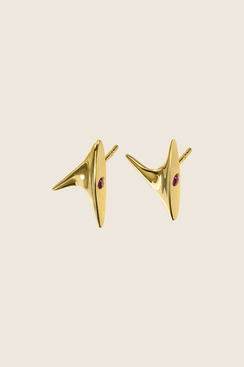 Discover the elegant stud earrings from UMIAR’s PROFONDO ROSSO collection. Inspired by the delicate thorn of a rose, they carry a subtle yet striking charm. Crafted from high-quality 925 sterling silver and 24-carat gold-plated silver, these earrings are not only visually exquisite but also durable. Adorned with two natural rubies, they offer a unique touch of brilliance. Perfect for those who appreciate elegance and finesse in jewellery.