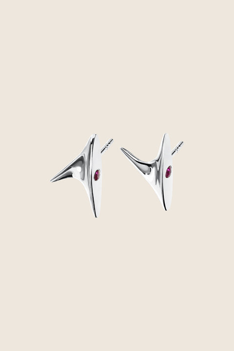 Discover the elegant stud earrings from UMIAR’s PROFONDO ROSSO collection. Inspired by the delicate thorn of a rose, they carry a subtle yet striking charm. Crafted from high-quality 925 sterling silver and 24-carat gold-plated silver, these earrings are not only visually exquisite but also durable. Adorned with two natural rubies, they offer a unique touch of brilliance. Perfect for those who appreciate elegance and finesse in jewellery.