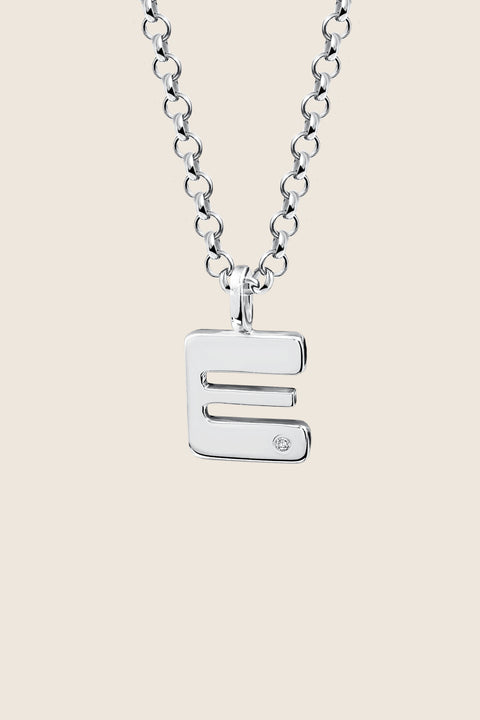 A delicate letter A pendant necklace inlaid with a natural diamond of 0.007 ct and 1.2 mm diameter. Suspended on a 50 cm chain, this timeless initial design offers a personal and elegant way to celebrate someone special. A refined keepsake that never goes out of style. Discover meaningful jewelry by UMIAR jewelry.
