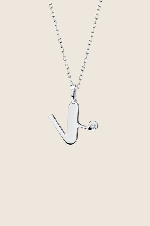 A delicate letter K pendant necklace inlaid with a natural diamond of 0.007 ct and 1.2 mm diameter. Suspended on a 50 cm chain, this timeless initial design offers a personal and elegant way to celebrate someone special. A refined keepsake that never goes out of style. Discover meaningful jewelry by UMIAR jewelry.