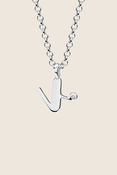 A delicate letter K pendant necklace inlaid with a natural diamond of 0.007 ct and 1.2 mm diameter. Suspended on a 50 cm chain, this timeless initial design offers a personal and elegant way to celebrate someone special. A refined keepsake that never goes out of style. Discover meaningful jewelry by UMIAR jewelry.