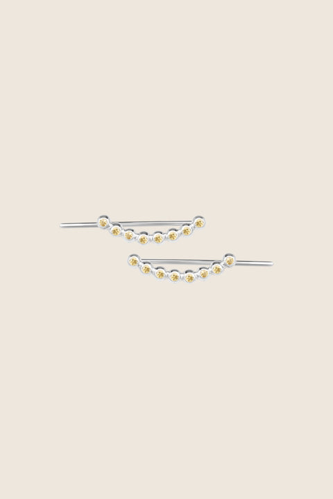 UMIAR jewellery presents monolithic earrings adorned with precious gemstones such as diamonds and topazes. A minimalist design with no clasps, handcrafted from 925 sterling silver or 24-carat gold-plated silver. Discover a new level of comfort and style — order yours today!