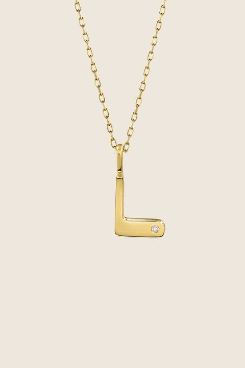 A delicate letter L pendant necklace inlaid with a natural diamond of 0.007 ct and 1.2 mm diameter. Suspended on a 50 cm chain, this timeless initial design offers a personal and elegant way to celebrate someone special. A refined keepsake that never goes out of style. Discover meaningful jewelry by UMIAR jewelry.