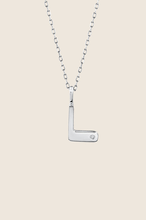 A delicate letter L pendant necklace inlaid with a natural diamond of 0.007 ct and 1.2 mm diameter. Suspended on a 50 cm chain, this timeless initial design offers a personal and elegant way to celebrate someone special. A refined keepsake that never goes out of style. Discover meaningful jewelry by UMIAR jewelry.