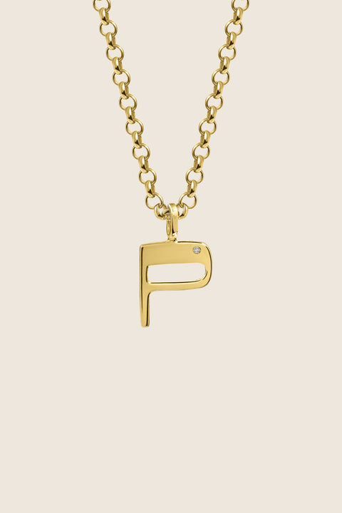 A delicate letter P pendant necklace inlaid with a natural diamond of 0.007 ct and 1.2 mm diameter. Suspended on a 50 cm chain, this timeless initial design offers a personal and elegant way to celebrate someone special. A refined keepsake that never goes out of style. Discover meaningful jewelry by UMIAR jewelry.