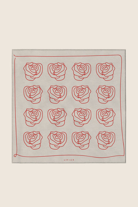 Discover a silk scarf with an original rose design by UMIAR jewellery, where the clean outline of a rose meets a striking colour palette of ecru and carmine. A perfect fusion of elegance and fashion in one accessory. This exceptional scarf, made from 100% natural silk, is part of the PROFONDO ROSSO collection. An ideal gift — beautifully packaged and ready to delight. Explore unique jewellery and silk scarves by UMIAR.