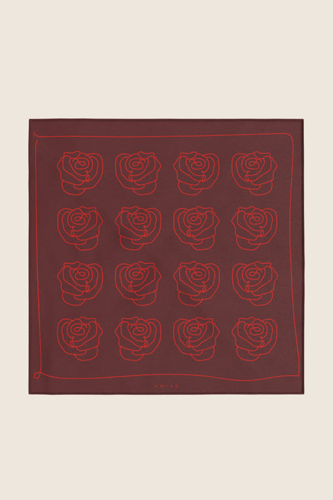 Discover a silk scarf with an original rose-inspired design by UMIAR jewellery. The clear rose outline in contrasting shades of red, burgundy, and carmine is set against a backdrop of timeless elegance. This exceptional scarf, made from 100% natural silk, comes from the PROFONDO ROSSO collection. A perfect gift idea — beautifully packaged and ready to delight someone special. Embrace elegance and style with UMIAR.