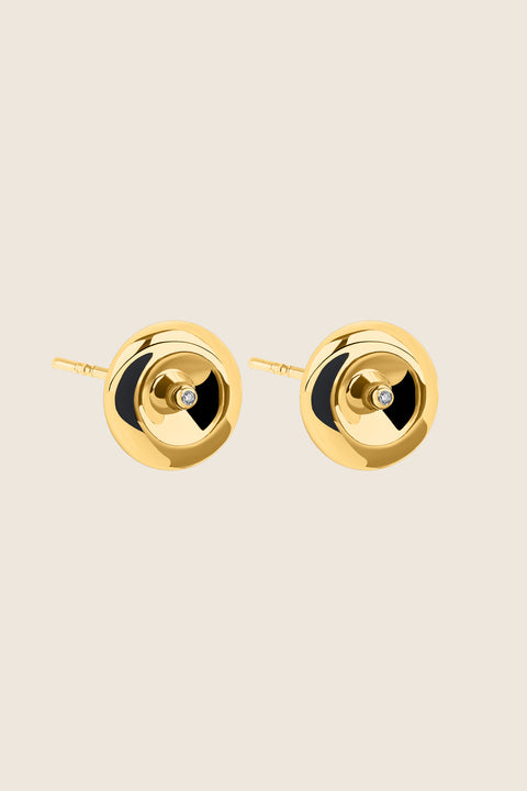 Round, elegant disc-shaped earrings with a subtle indentation, where a small setting with a natural diamond (0.007 ct) is placed. A refined and minimalist design, perfectly suited for both everyday wear and special occasions. Choose UMIAR jewelry and highlight your uniqueness!