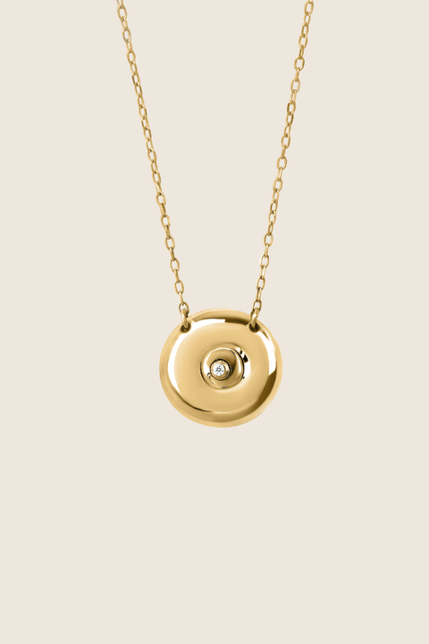 Discover the elegant pendant necklace with a natural diamond by UMIAR jewellery, handcrafted from 925 sterling silver. Its unique round disc with a recessed bead blends timeless style with a modern touch, symbolising femininity, closeness, and the cycles of life. A perfect gift for special occasions — shop now!