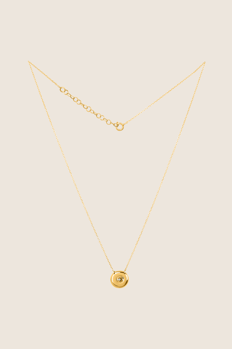 Discover the elegant pendant necklace with a natural diamond by UMIAR jewellery, handcrafted from 925 sterling silver. Its unique round disc with a recessed bead blends timeless style with a modern touch, symbolising femininity, closeness, and the cycles of life. A perfect gift for special occasions — shop now!