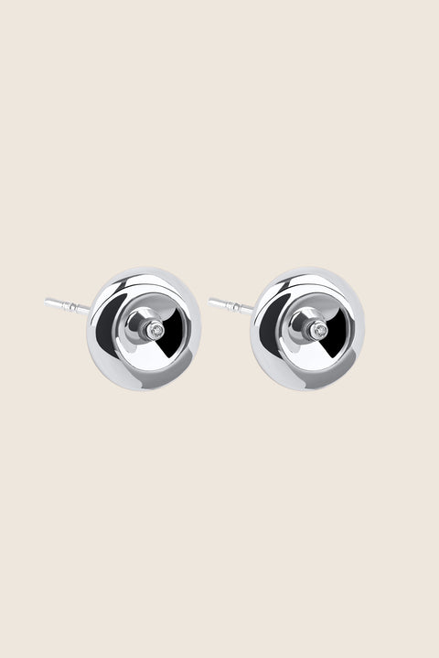 Round, elegant disc-shaped earrings with a subtle indentation, where a small setting with a natural diamond (0.007 ct) is placed. A refined and minimalist design, perfectly suited for both everyday wear and special occasions. Choose UMIAR jewelry and highlight your uniqueness!