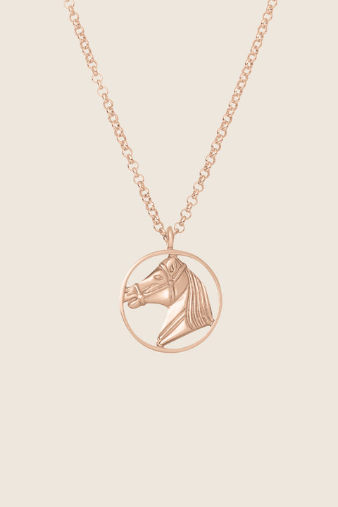 An elegant necklace featuring a hand-sculpted horse pendant, crafted in 14k rose gold. It embodies the symbolism of strength, freedom and timeless elegance. A unique talisman for those who appreciate refined style and jewelry with an artistic character. Discover the exceptional quality of UMIAR jewelry and order online.