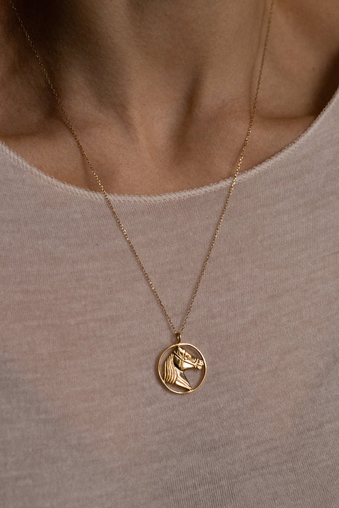 This elegant necklace with a double-sided sculpted horse pendant is a distinctive piece that embodies strength, freedom and timeless elegance. It subtly enhances everyday looks, becoming a personal talisman for those who appreciate refined style. Available in sterling silver and gold-plated sterling silver. Discover UMIAR jewelry and order online.