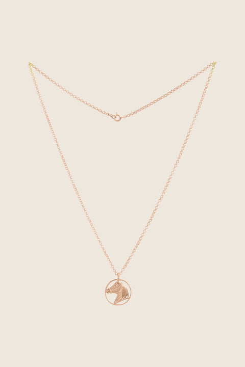 An elegant necklace featuring a hand-sculpted horse pendant, crafted in 14k rose gold. It embodies the symbolism of strength, freedom and timeless elegance. A unique talisman for those who appreciate refined style and jewelry with an artistic character. Discover the exceptional quality of UMIAR jewelry and order online.