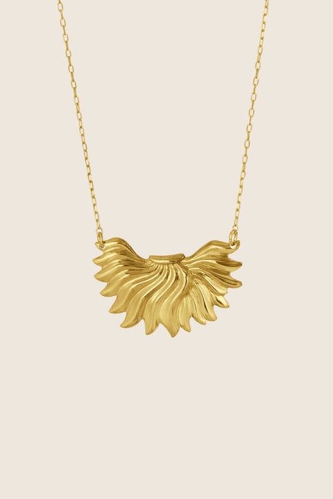 The IGNIS decorative necklace, featuring an intricately sculpted flame, symbolizes strength, courage and love. Inspired by a vintage spirit yet maintaining a modern character, it sits beautifully on the neckline and enhances any look. A timeless UMIAR jewelry piece — discover it and order online.