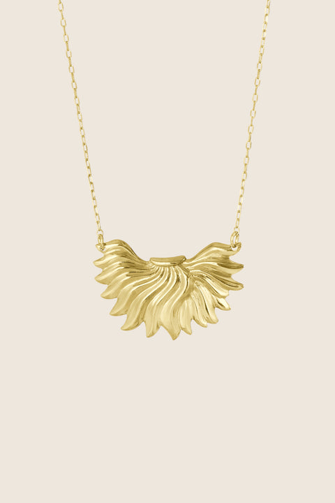 The IGNIS decorative necklace crafted in 14k gold features a sculpted flame pendant — a symbol of strength, courage and love. Vintage inspiration meets modern character, creating a timeless accent that rests beautifully on the neckline and complements both everyday and evening looks. Discover UMIAR jewelry.