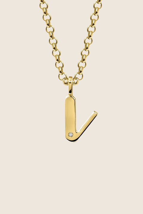 A delicate letter V pendant necklace inlaid with a natural diamond of 0.007 ct and 1.2 mm diameter. Suspended on a 50 cm chain, this timeless initial design offers a personal and elegant way to celebrate someone special. A refined keepsake that never goes out of style. Discover meaningful jewelry by UMIAR jewelry.