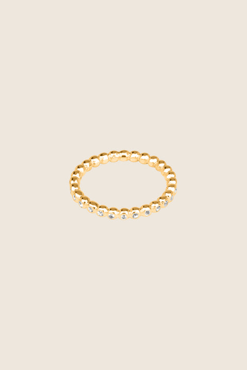 A timeless band ring fully inlaid with fine gemstones set in a refined beaded setting. Available with diamonds or sapphires, it balances minimalist form with decorative brilliance. Featuring 1.25 mm stones, it is ideal as a modern wedding band or distinctive engagement ring. Discover subtle elegance by UMIAR jewelry.