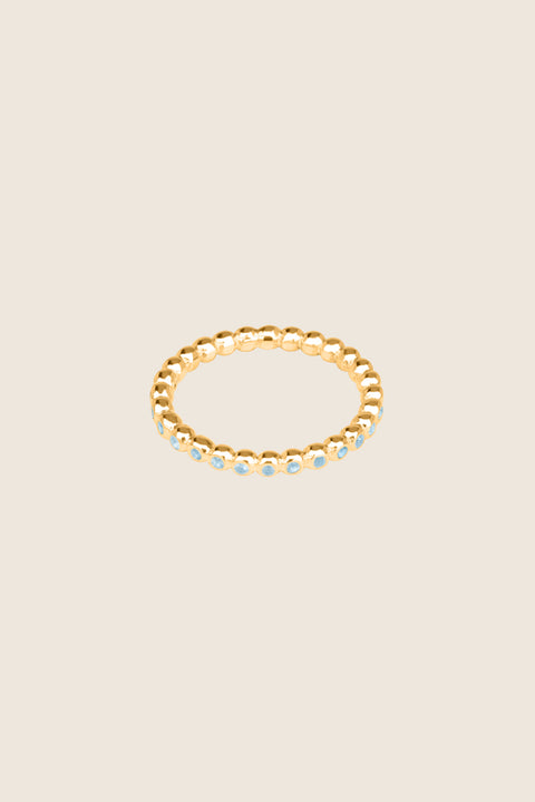A timeless band ring fully inlaid with fine gemstones set in a refined beaded setting. Available with diamonds or sapphires, it balances minimalist form with decorative brilliance. Featuring 1.25 mm stones, it is ideal as a modern wedding band or distinctive engagement ring. Discover subtle elegance by UMIAR jewelry.
