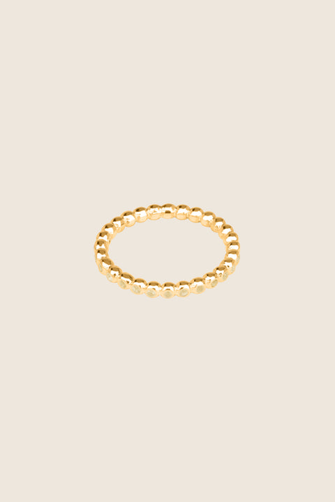 A timeless band ring fully inlaid with fine gemstones set in a refined beaded setting. Available with diamonds or sapphires, it balances minimalist form with decorative brilliance. Featuring 1.25 mm stones, it is ideal as a modern wedding band or distinctive engagement ring. Discover subtle elegance by UMIAR jewelry.