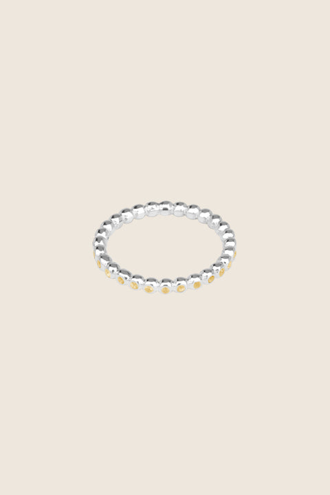 A timeless band ring fully inlaid with fine gemstones set in a refined beaded setting. Available with diamonds or sapphires, it balances minimalist form with decorative brilliance. Featuring 1.25 mm stones, it is ideal as a modern wedding band or distinctive engagement ring. Discover subtle elegance by UMIAR jewelry.