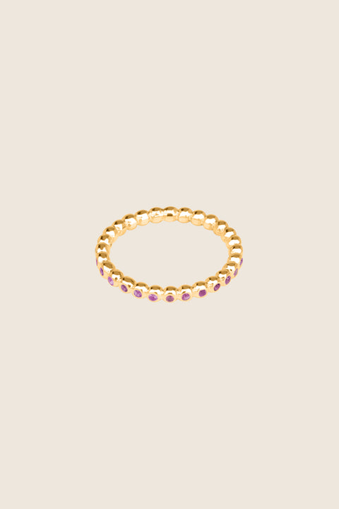 A timeless band ring fully inlaid with fine gemstones set in a refined beaded setting. Available with diamonds or sapphires, it balances minimalist form with decorative brilliance. Featuring 1.25 mm stones, it is ideal as a modern wedding band or distinctive engagement ring. Discover subtle elegance by UMIAR jewelry.
