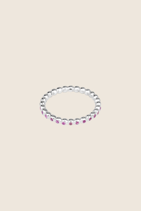 A timeless band ring fully inlaid with fine gemstones set in a refined beaded setting. Available with diamonds or sapphires, it balances minimalist form with decorative brilliance. Featuring 1.25 mm stones, it is ideal as a modern wedding band or distinctive engagement ring. Discover subtle elegance by UMIAR jewelry.