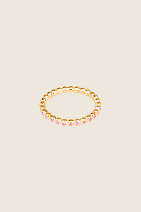 A timeless band ring fully inlaid with fine gemstones set in a refined beaded setting. Available with diamonds or sapphires, it balances minimalist form with decorative brilliance. Featuring 1.25 mm stones, it is ideal as a modern wedding band or distinctive engagement ring. Discover subtle elegance by UMIAR jewelry.