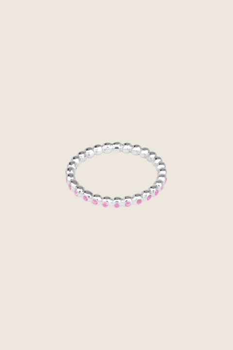 A timeless band ring fully inlaid with fine gemstones set in a refined beaded setting. Available with diamonds or sapphires, it balances minimalist form with decorative brilliance. Featuring 1.25 mm stones, it is ideal as a modern wedding band or distinctive engagement ring. Discover subtle elegance by UMIAR jewelry.