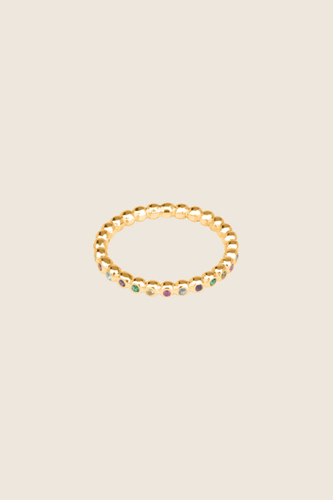 A timeless band ring fully inlaid with fine gemstones set in a refined beaded setting. Available with diamonds or sapphires, it balances minimalist form with decorative brilliance. Featuring 1.25 mm stones, it is ideal as a modern wedding band or distinctive engagement ring. Discover subtle elegance by UMIAR jewelry.