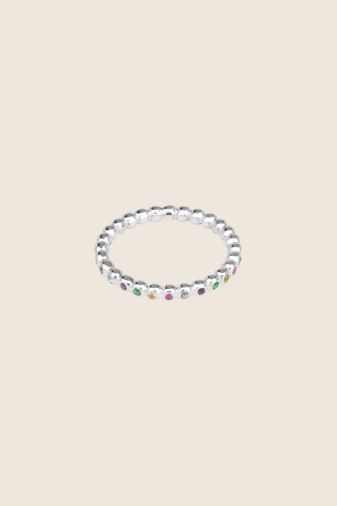A timeless band ring fully inlaid with fine gemstones set in a refined beaded setting. Available with diamonds or sapphires, it balances minimalist form with decorative brilliance. Featuring 1.25 mm stones, it is ideal as a modern wedding band or distinctive engagement ring. Discover subtle elegance by UMIAR jewelry.