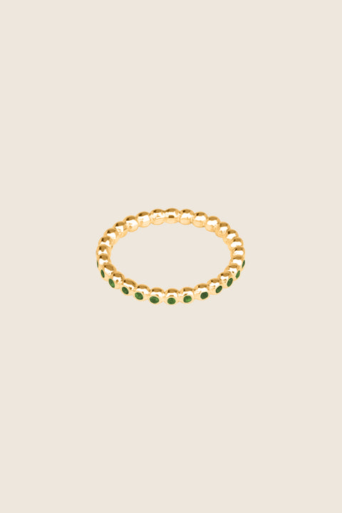 A timeless band ring fully inlaid with fine gemstones set in a refined beaded setting. Available with diamonds or sapphires, it balances minimalist form with decorative brilliance. Featuring 1.25 mm stones, it is ideal as a modern wedding band or distinctive engagement ring. Discover subtle elegance by UMIAR jewelry.