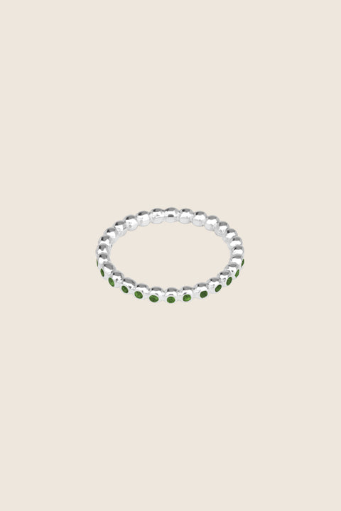 A timeless band ring fully inlaid with fine gemstones set in a refined beaded setting. Available with diamonds or sapphires, it balances minimalist form with decorative brilliance. Featuring 1.25 mm stones, it is ideal as a modern wedding band or distinctive engagement ring. Discover subtle elegance by UMIAR jewelry.
