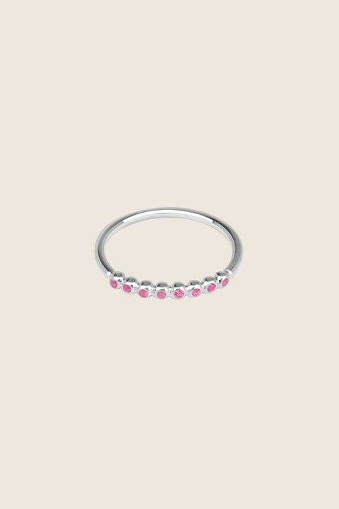 An elegant band ring featuring eight gemstones set in a refined beaded setting. Available with diamonds or topaz stones in monochrome or colorful combinations, this versatile design blends contemporary style with timeless elegance. Featuring 1.25 mm stones, it pairs beautifully with PLURES bands and the ILLE III ring. Discover refined versatility by UMIAR jewelry.