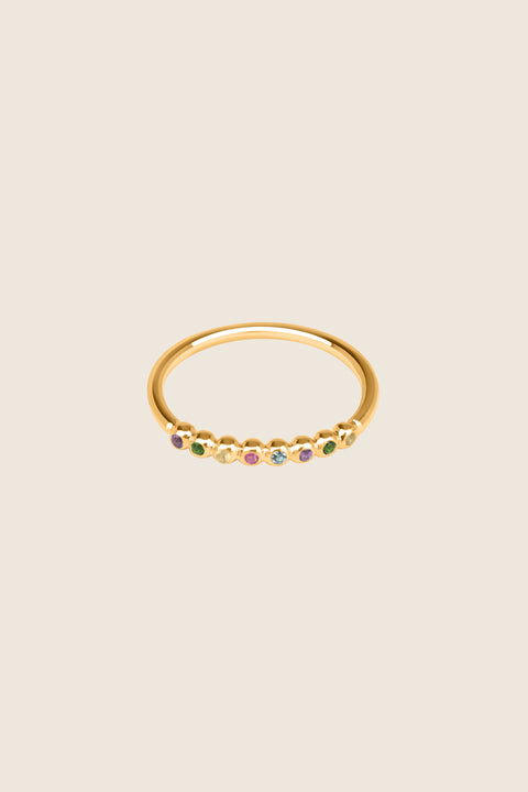An elegant band ring featuring eight gemstones set in a refined beaded setting. Available with diamonds or topaz stones in monochrome or colorful combinations, this versatile design blends contemporary style with timeless elegance. Featuring 1.25 mm stones, it pairs beautifully with PLURES bands and the ILLE III ring. Discover refined versatility by UMIAR jewelry.