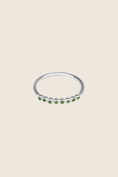 An elegant band ring featuring eight gemstones set in a refined beaded setting. Available with diamonds or topaz stones in monochrome or colorful combinations, this versatile design blends contemporary style with timeless elegance. Featuring 1.25 mm stones, it pairs beautifully with PLURES bands and the ILLE III ring. Discover refined versatility by UMIAR jewelry.