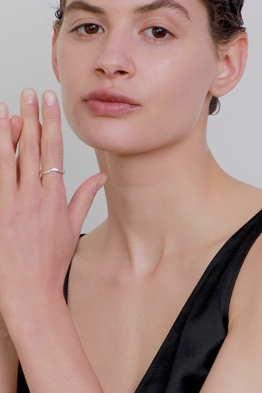 An elegant band ring with a fluid shape that shifts from a straight form into a gentle wave, symbolizing life and emotional flow. A UMIAR bestseller, it blends classic minimalism with subtle movement—perfect as a modern wedding band or an everyday essential. Discover timeless design with meaning by UMIAR jewelry.
