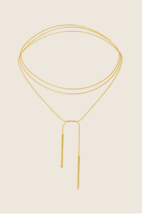A handcrafted choker combining two 33 mm silver tube elements with a 120 cm chain. Designed for versatile styling, the chain can be tied, layered, or worn loose, including as a back neckline accent. Elegant silver ends ensure a perfect drape and refined finish. Discover modern, adaptable jewelry by UMIAR jewelry.