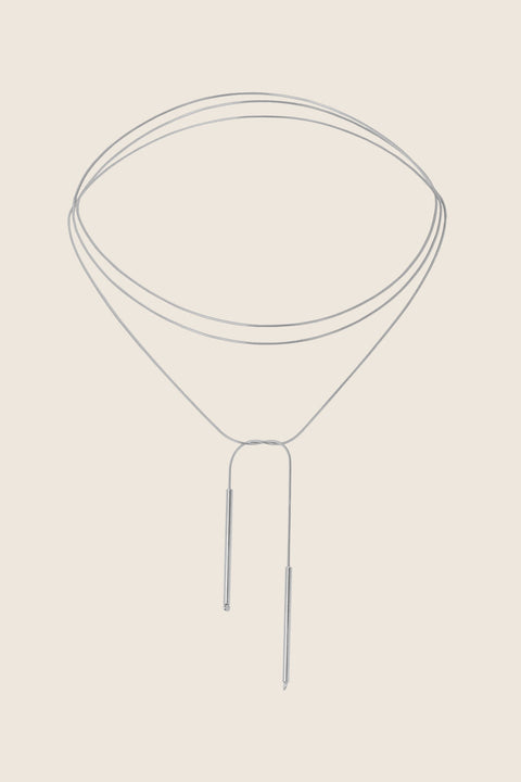 A handcrafted choker combining two 33 mm silver tube elements with a 120 cm chain. Designed for versatile styling, the chain can be tied, layered, or worn loose, including as a back neckline accent. Elegant silver ends ensure a perfect drape and refined finish. Discover modern, adaptable jewelry by UMIAR jewelry.