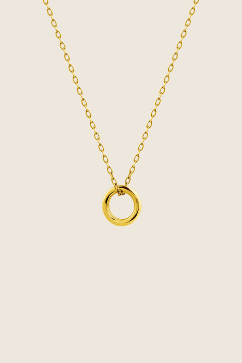 A minimalist necklace featuring a small circular pendant symbolizing balance and harmony. With a 10 mm pendant suspended on a 40 cm silver chain, it offers a delicate, understated accent ideal for everyday wear. A timeless talisman designed to complement any look. Discover refined simplicity by UMIAR jewelry.