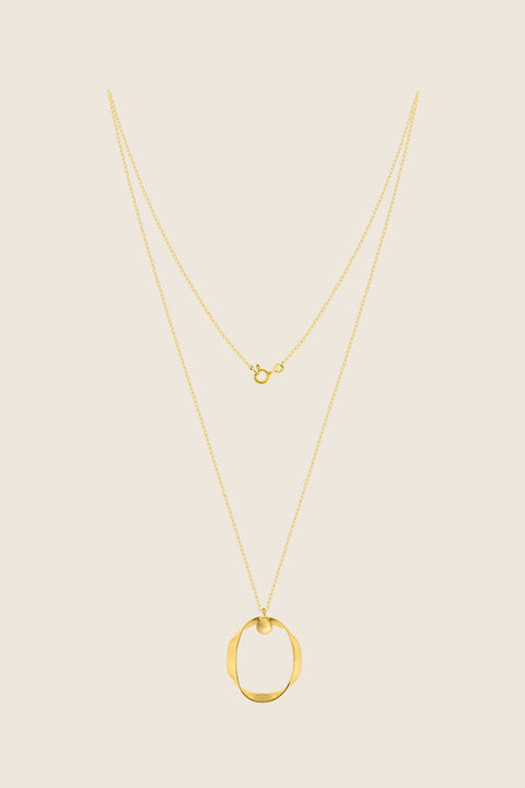 A minimalist silver pendant inspired by feminine intimacy, designed as a sculptural, three-dimensional form made from a softly contoured ribbon. Suspended on a 50 cm silver chain, it celebrates the beauty of the body through symbolic design and refined craftsmanship. Discover expressive elegance by UMIAR jewelry.
