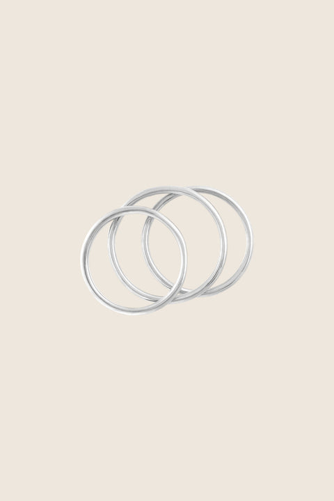 A refined set of three delicate band rings designed for versatile styling—wear them individually, stacked, or as knuckle rings. Minimalist and elegant, they offer endless combinations and effortless everyday wear. A perfect choice for lovers of subtle design and adaptable jewelry. Discover modern versatility by UMIAR jewelry.