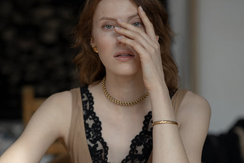 A rigid silver bangle inspired by hammered textures, designed to reflect light and emphasize a sculptural, three-dimensional form. Elegant worn solo or styled with the CRATER bracelet, it offers refined strength and timeless appeal. Discover expressive craftsmanship and modern elegance by UMIAR jewelry.