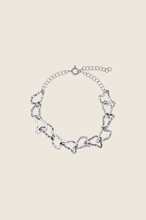 A multidimensional bracelet from the CAPRI collection by UMIAR jewellery, inspired by the contours of Monte Solaro — the highest peak of Capri. Handcrafted links adorn 925 sterling silver and 24-carat gold-plated silver. The adjustable length ensures a comfortable fit. Inspired by the island’s topography, this design reflects the graphic rhythm of its mountains and hills — a perfect harmony of nature and elegance.