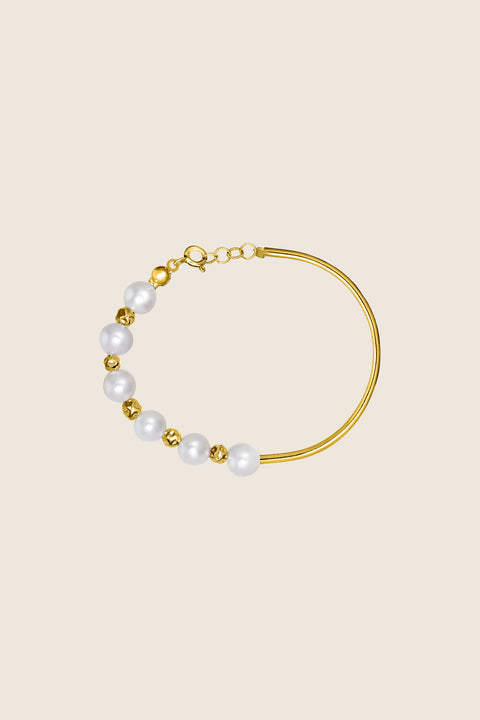 Discover the LINEA bracelet from UMIAR Jewellery’s MÉLANGÉ collection — a minimalist silver tube paired with natural pearls and small beads. Handcrafted in 925 sterling silver or 24k gold-plated silver, it blends the lightness of beaded jewellery with the refinement of precious materials. A subtle, elegant accent for any look.
