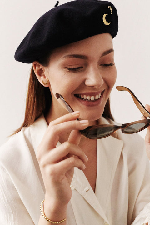 Moon-shaped stud earrings accented with star details combine vintage charm with a timeless astral motif. Measuring 17 × 14 mm, they can be worn vertically or horizontally for versatile styling. Elegant worn alone or layered with MUUN necklaces. Discover celestial elegance by UMIAR jewelry.