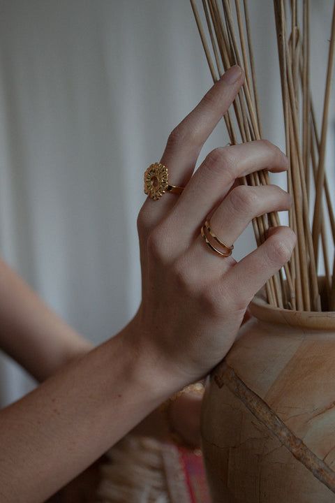 Discover the delicate square-profile ring from UMIAR Jewellery, handcrafted in 925 sterling silver or 24k gold-plated silver. Perfect worn solo or stacked with other rings. Its subtle elegance and minimalist design make it an ideal choice for anyone who appreciates refined, timeless style. Add a unique accent to your collection — shop now and enjoy its enduring beauty!