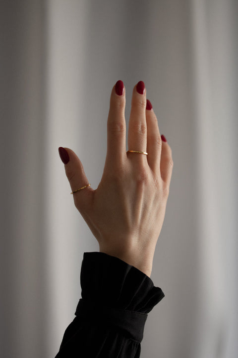 Discover the delicate square-profile ring from UMIAR Jewellery, handcrafted in 925 sterling silver or 24k gold-plated silver. Perfect worn solo or stacked with other rings. Its subtle elegance and minimalist design make it an ideal choice for anyone who appreciates refined, timeless style. Add a unique accent to your collection — shop now and enjoy its enduring beauty!